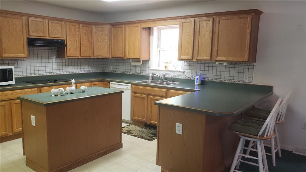 113 Ross Road Ligonier, PA 15658 - Photo 7 of 29 a kitchen with a sink stove and cabinets