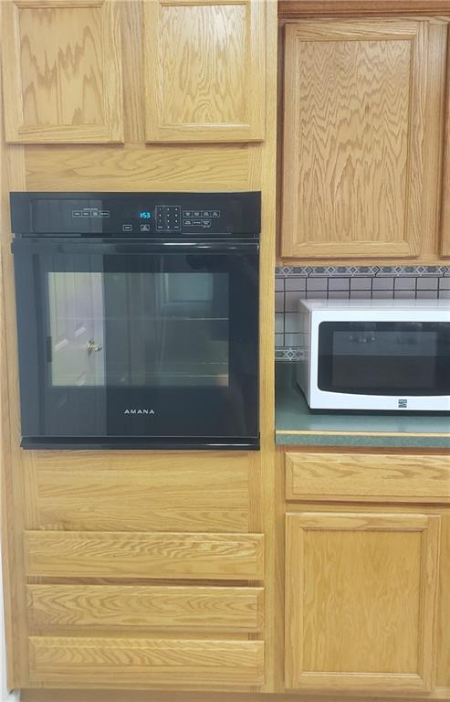 113 Ross Road Ligonier, PA 15658 - Photo 8 of 29 a stove top oven sitting inside of a kitchen