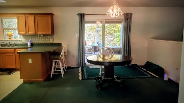 a room with furniture a window and a chandelier