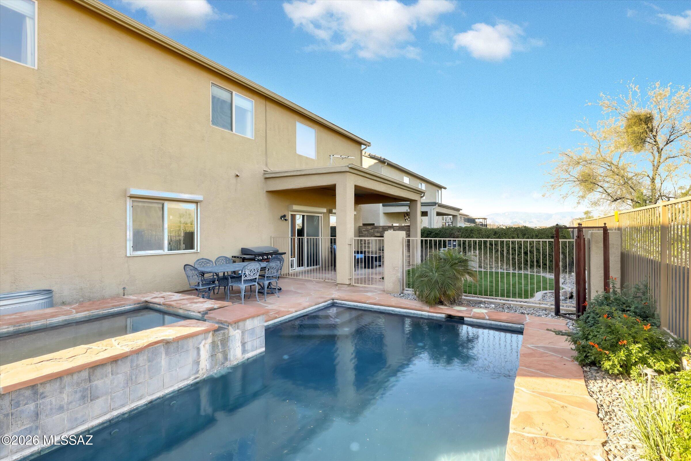 6095 South Jakemp Trail Tucson, AZ 85747 - Photo 47 of 52 a view of a house with swimming pool