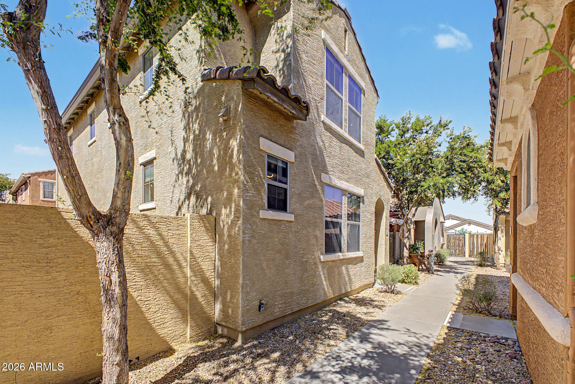 451 South Hawes Road, Unit 27 Mesa, AZ 85208 - Photo 2 of 27 a view of a house with a tree