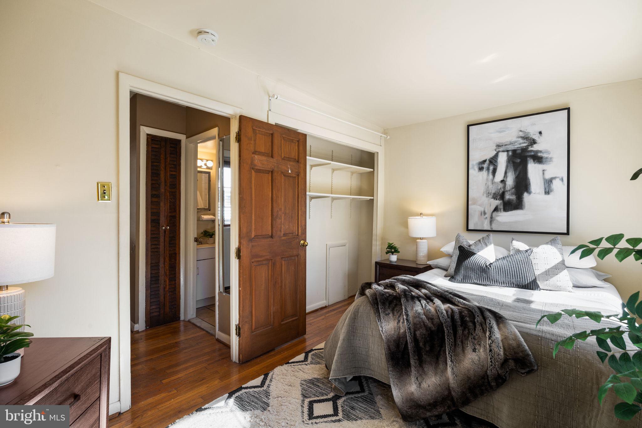 1905 Rodman Street Philadelphia, PA 19146 - Photo 11 of 22 a bedroom with a bed and a potted plant next to a window