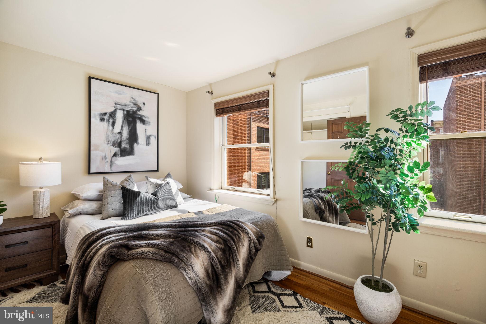 1905 Rodman Street Philadelphia, PA 19146 - Photo 12 of 22 a bedroom with bed and a potted plant