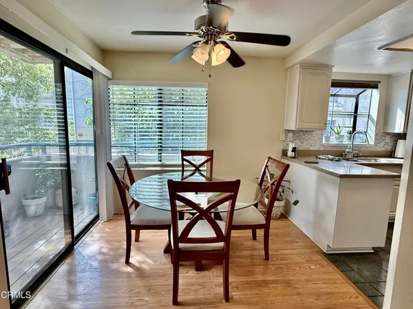 a dining room with furniture and a chandelier