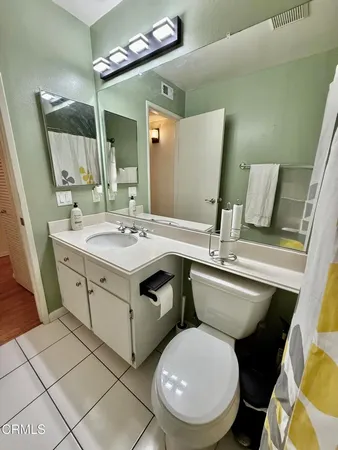 a view of a hallway with washer and dryer