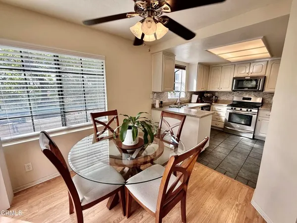 a view of a dining room with furniture and wooden floor