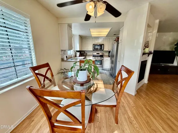 a kitchen with a table chairs and a stove