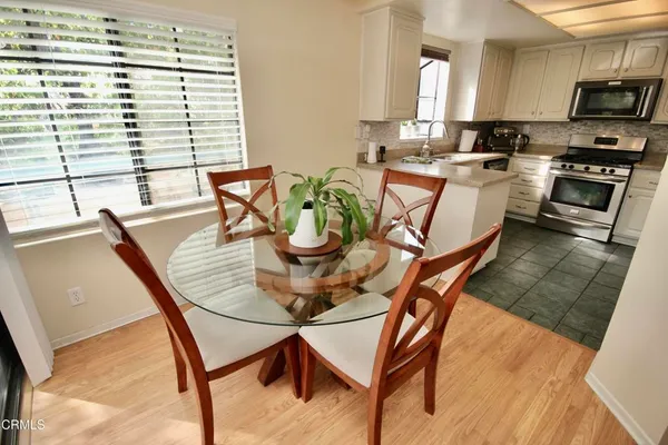 a kitchen with stainless steel appliances a stove sink and microwave