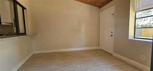 a view of a room that has a window in it