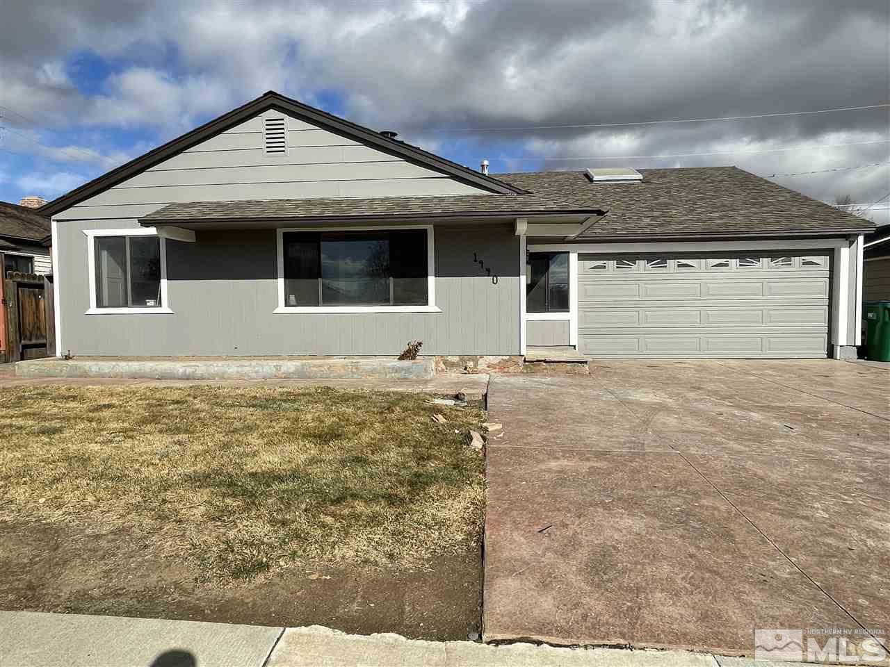 a front view of a house with yard