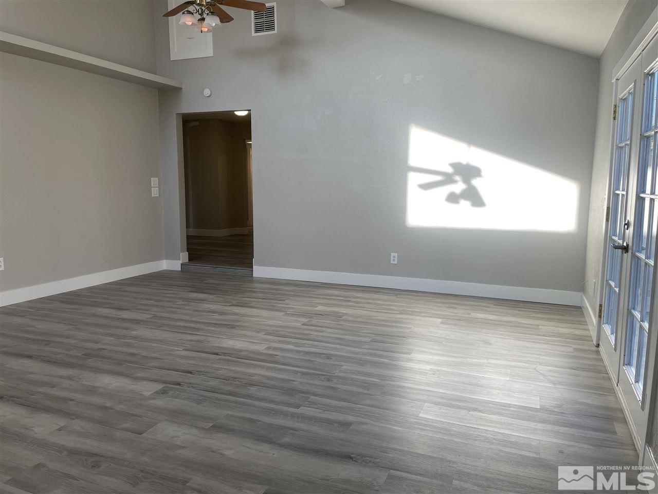 1440 Upton Way Sparks, NV 89431 - Photo 12 of 28 a view of room with window and wooden floor