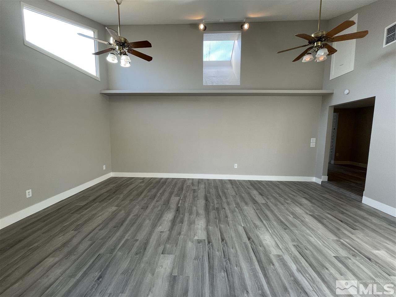 1440 Upton Way Sparks, NV 89431 - Photo 14 of 28 wooden floor in an empty room with a window