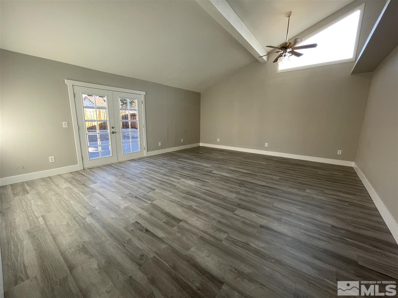 1440 Upton Way Sparks, NV 89431 - Photo 15 of 28 a view of an empty room with wooden floor and a window