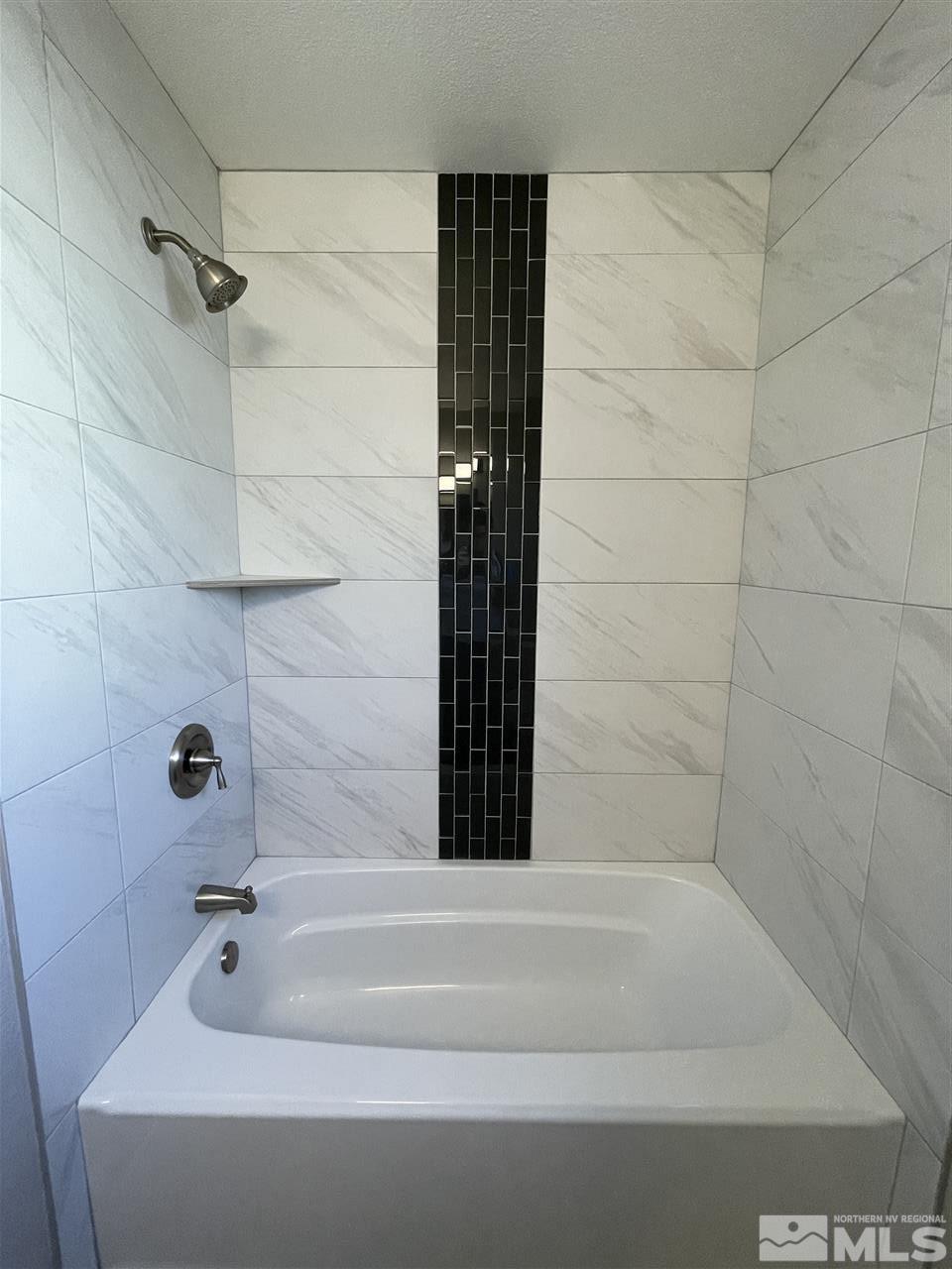 1440 Upton Way Sparks, NV 89431 - Photo 18 of 28 a bathroom with a bathtub and shower