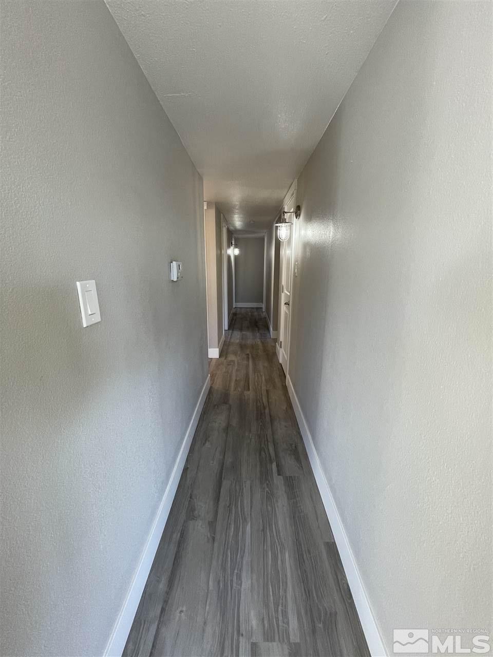 1440 Upton Way Sparks, NV 89431 - Photo 20 of 28 a view of a hallway with wooden floor