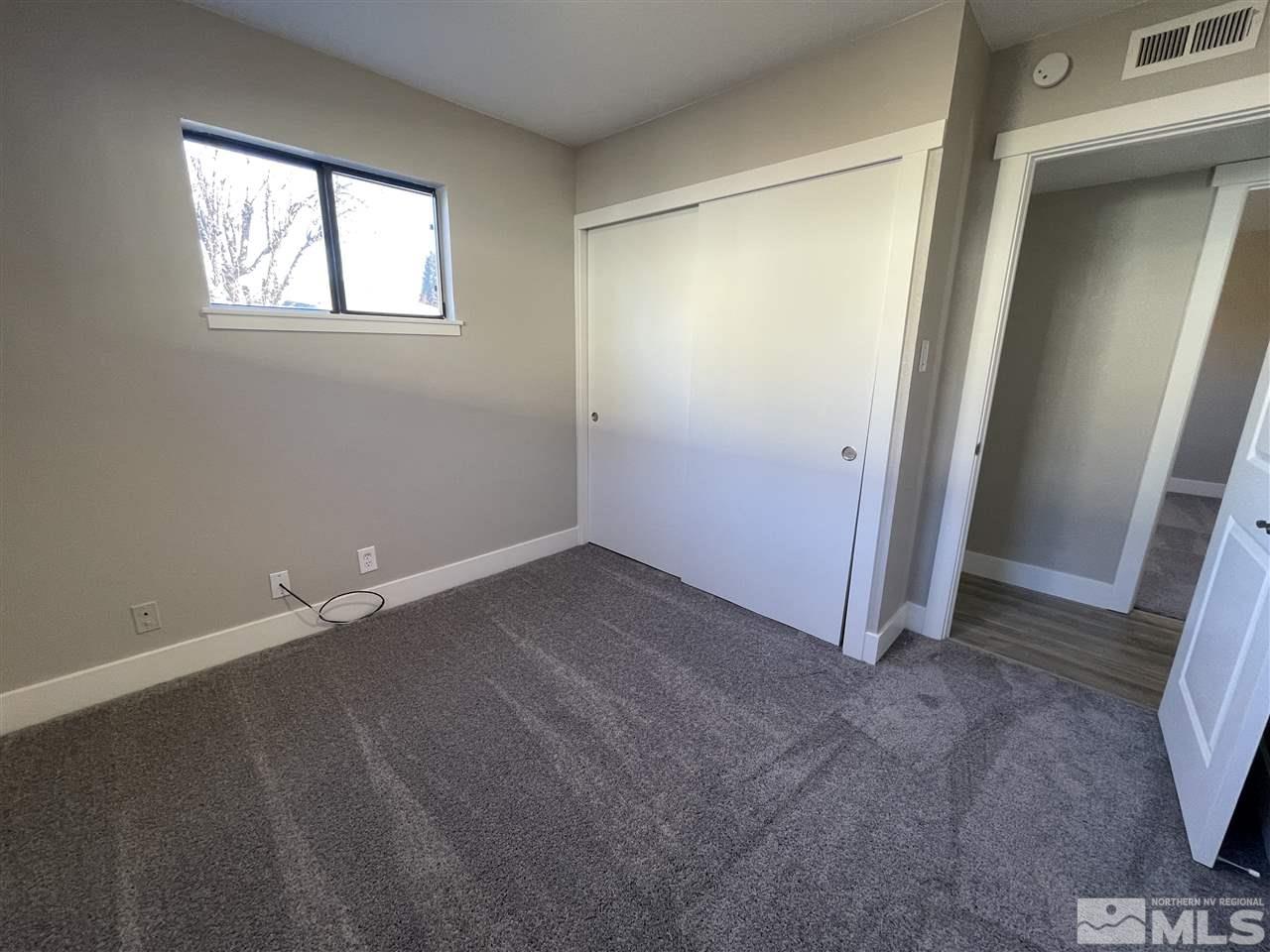 1440 Upton Way Sparks, NV 89431 - Photo 22 of 28 an empty room with windows