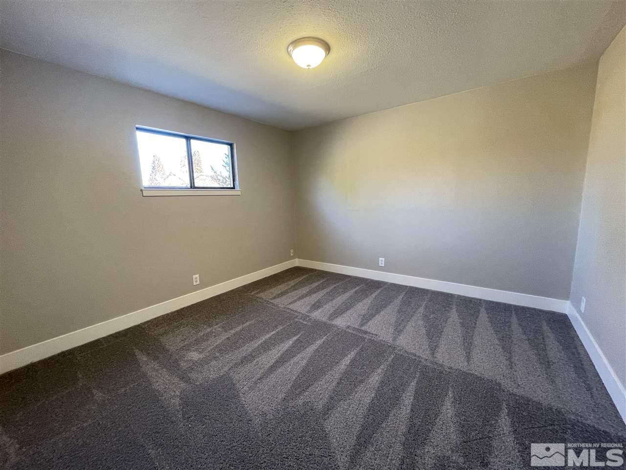 1440 Upton Way Sparks, NV 89431 - Photo 25 of 28 a view of a room with wooden floor and windows