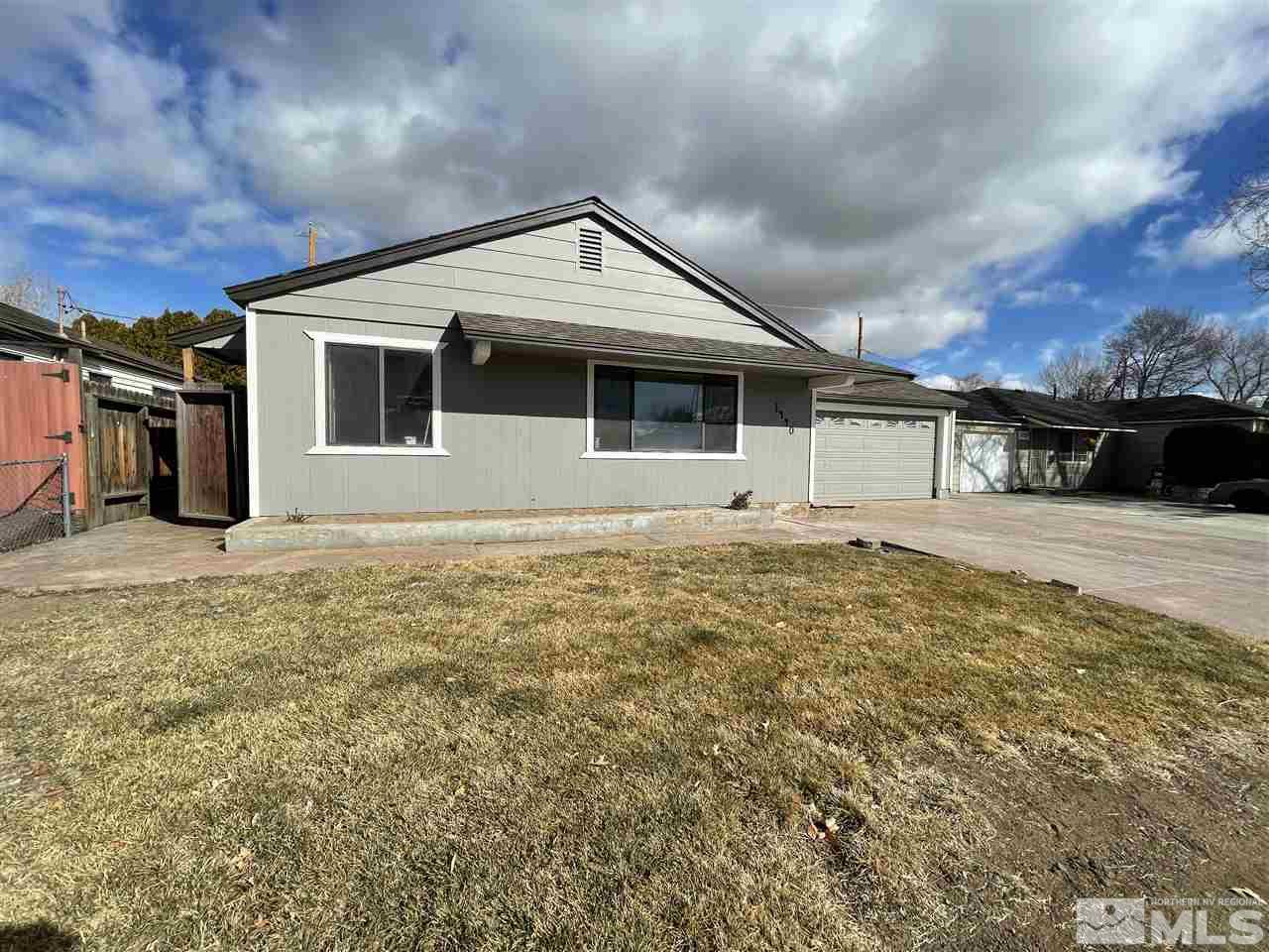 1440 Upton Way Sparks, NV 89431 - Photo 28 of 28 a front view of a house with garden