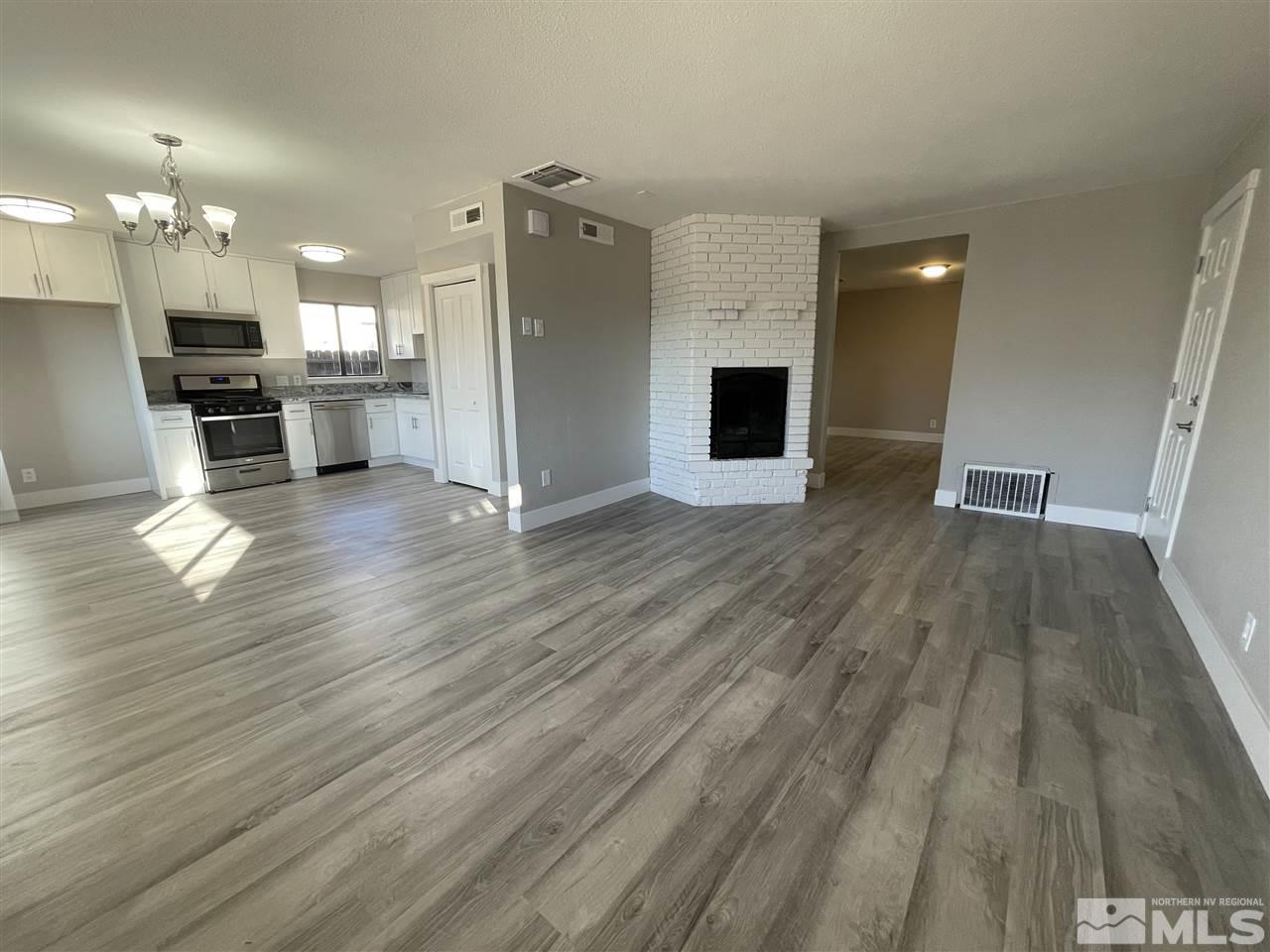 1440 Upton Way Sparks, NV 89431 - Photo 3 of 28 a view of kitchen with cabinets appliances and wooden floor