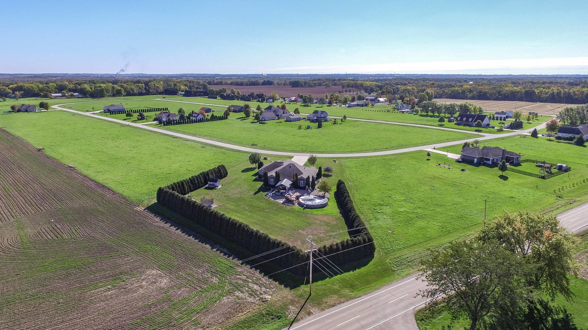 2426 North 4220th Road Sheridan, IL 60551 - Photo 4 of 11 an aerial view of a golf course with a garden