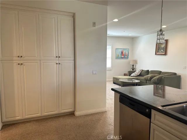 a view of kitchen island with furniture and wooden cabinets