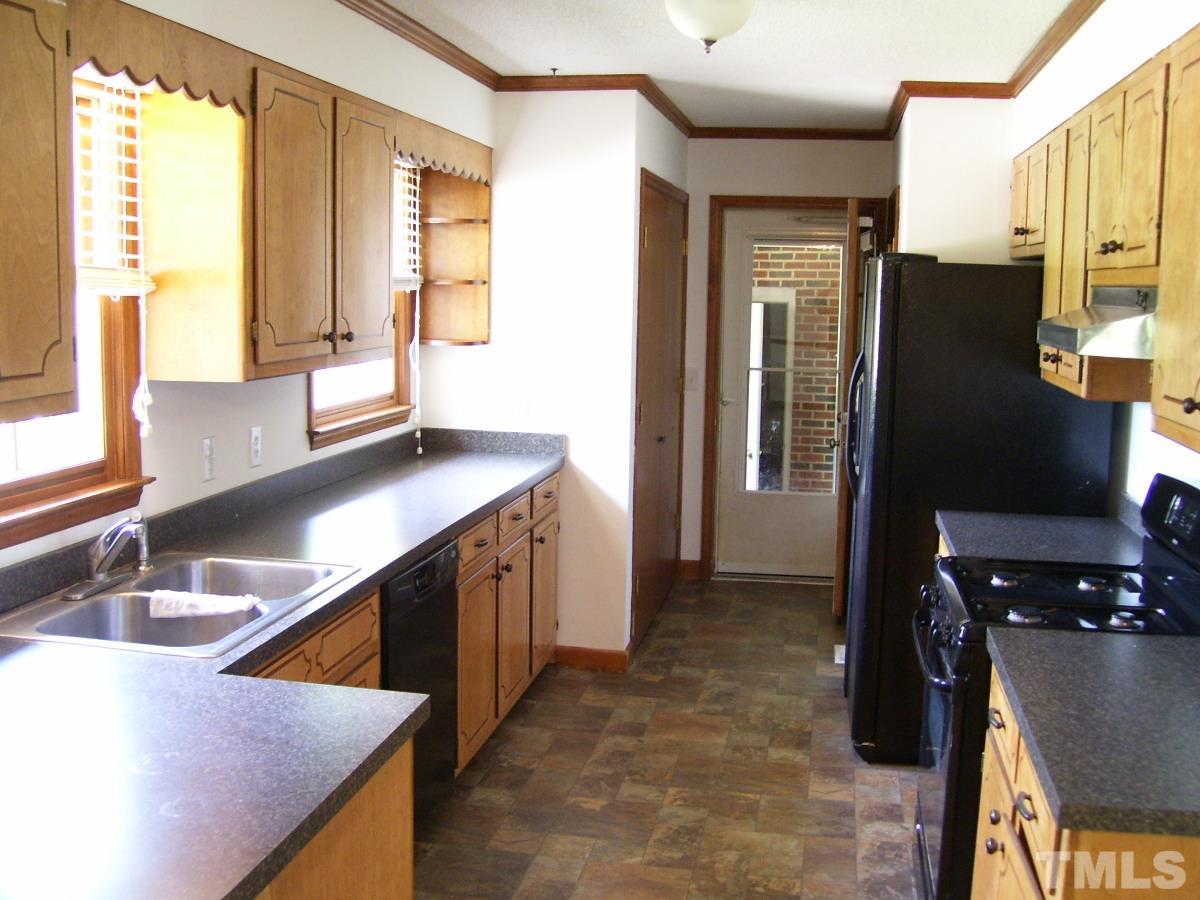 213 Red Mountain Road Rougemont, NC 27572 - Photo 2 of 18 a kitchen with stainless steel appliances granite countertop a sink a refrigerator and a stove