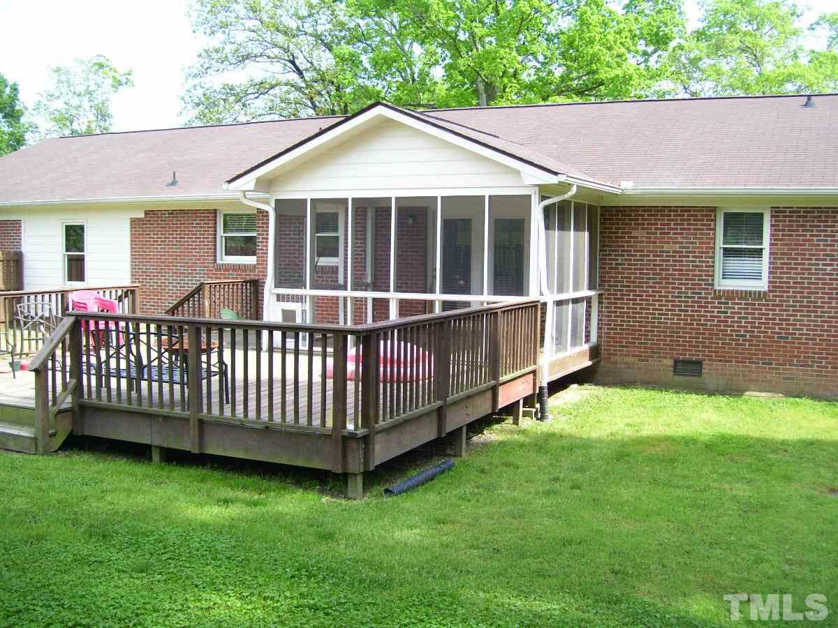 213 Red Mountain Road Rougemont, NC 27572 - Photo 13 of 18 a view of a house with a yard and deck