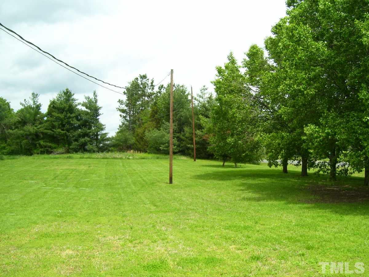 213 Red Mountain Road Rougemont, NC 27572 - Photo 18 of 18 a view of a field with a tree