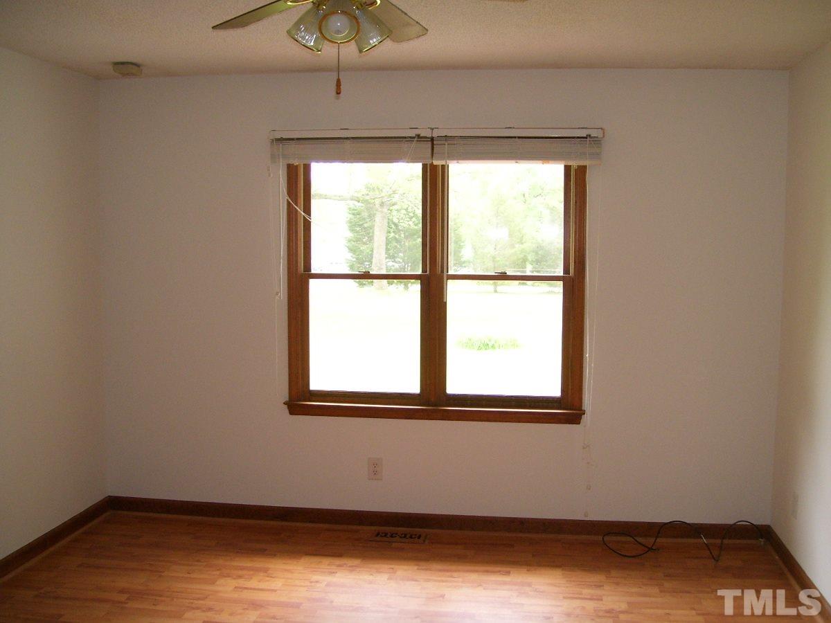 213 Red Mountain Road Rougemont, NC 27572 - Photo 7 of 18 an empty room with a window