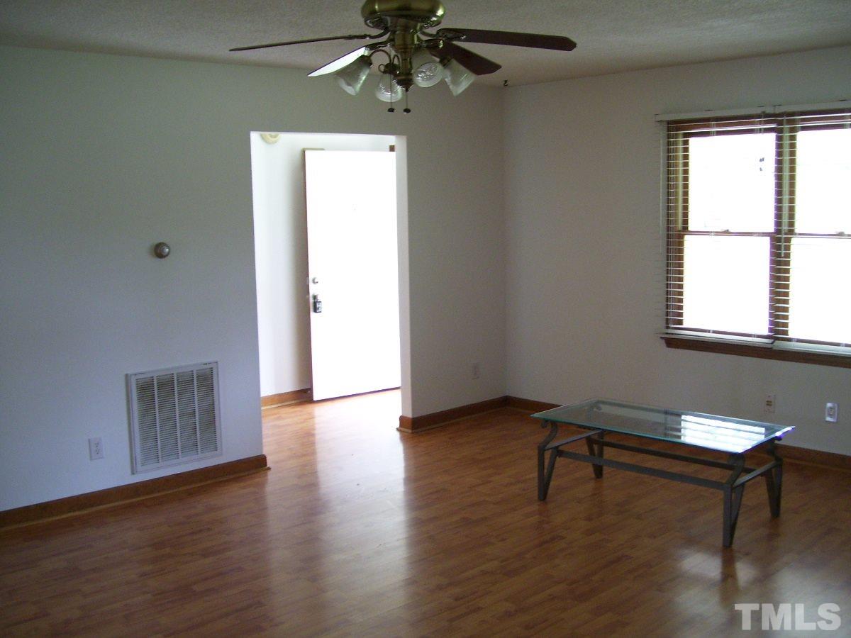 213 Red Mountain Road Rougemont, NC 27572 - Photo 9 of 18 a view of livingroom with hardwood floor and workspace