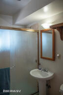 511 Mance Street Bisbee, AZ 85603 - Photo 19 of 22 a bathroom with a sink and a mirror