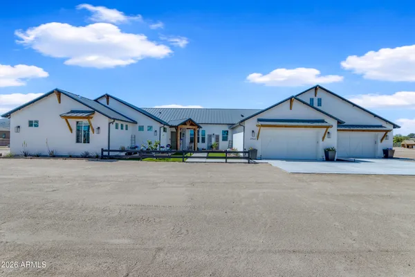 an aerial view of a house with outdoor space