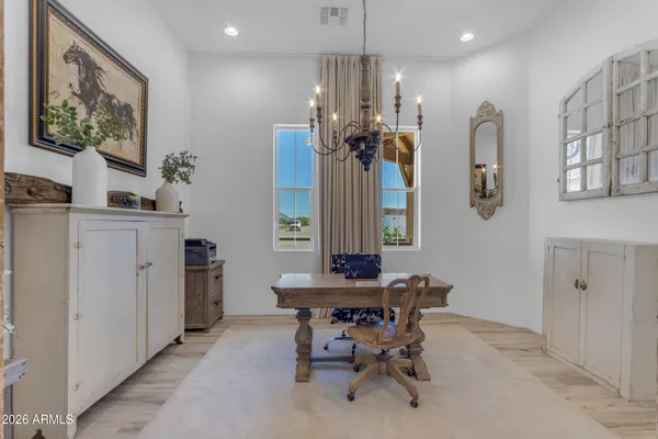 a spacious bathroom with a double vanity sink a mirror and a shower