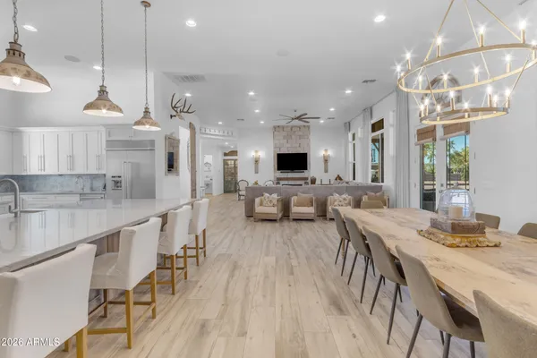 a en suite bathroom with a granite countertop sink and a mirror