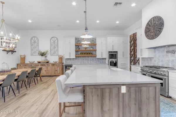 a view of a house with a yard and pathway