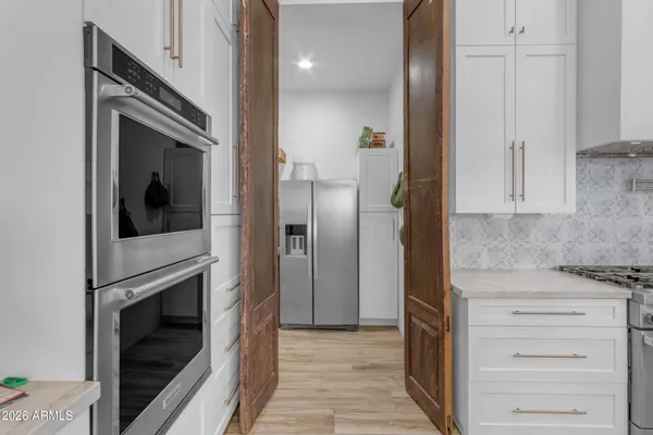 a view of a utility room with racks on the wall