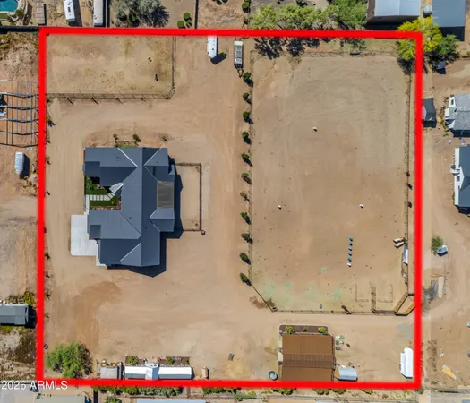 a view of a livingroom with furniture and a floor to ceiling window