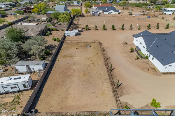 a living room with furniture and a view of kitchen