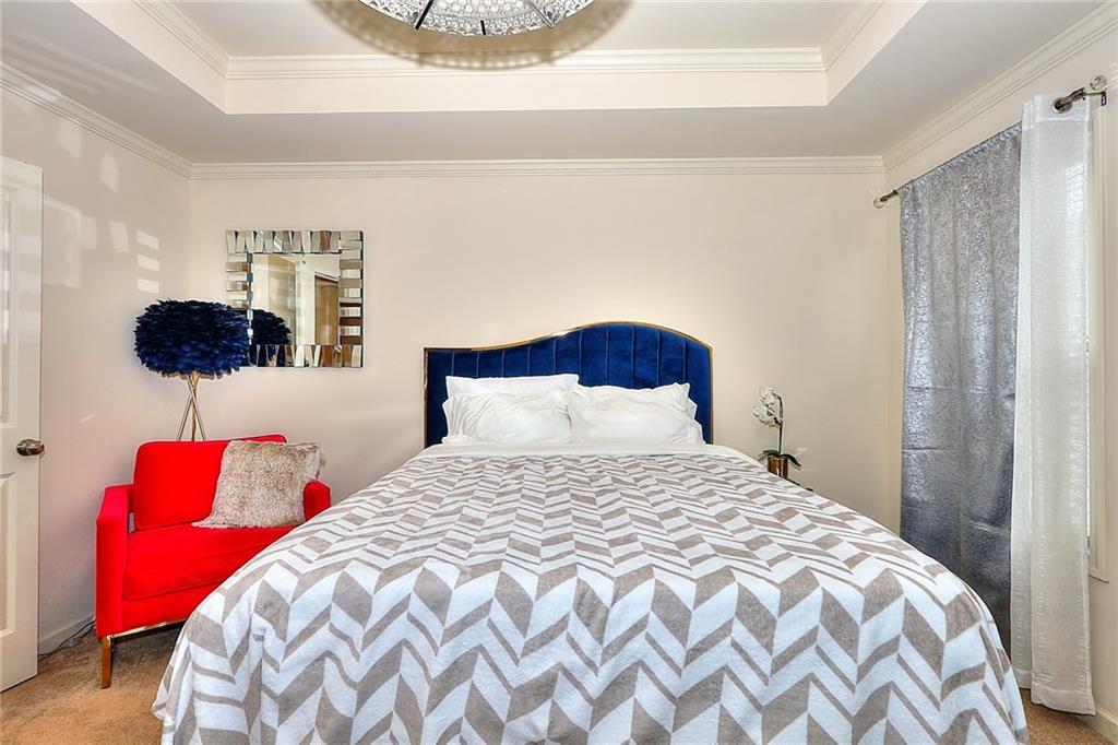 1306 Harris Way South Atlanta, GA 30319 - Photo 7 of 19 a bedroom with a bed and a painting on the wall