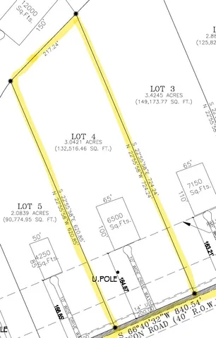 a view of a bench in backyard of a building