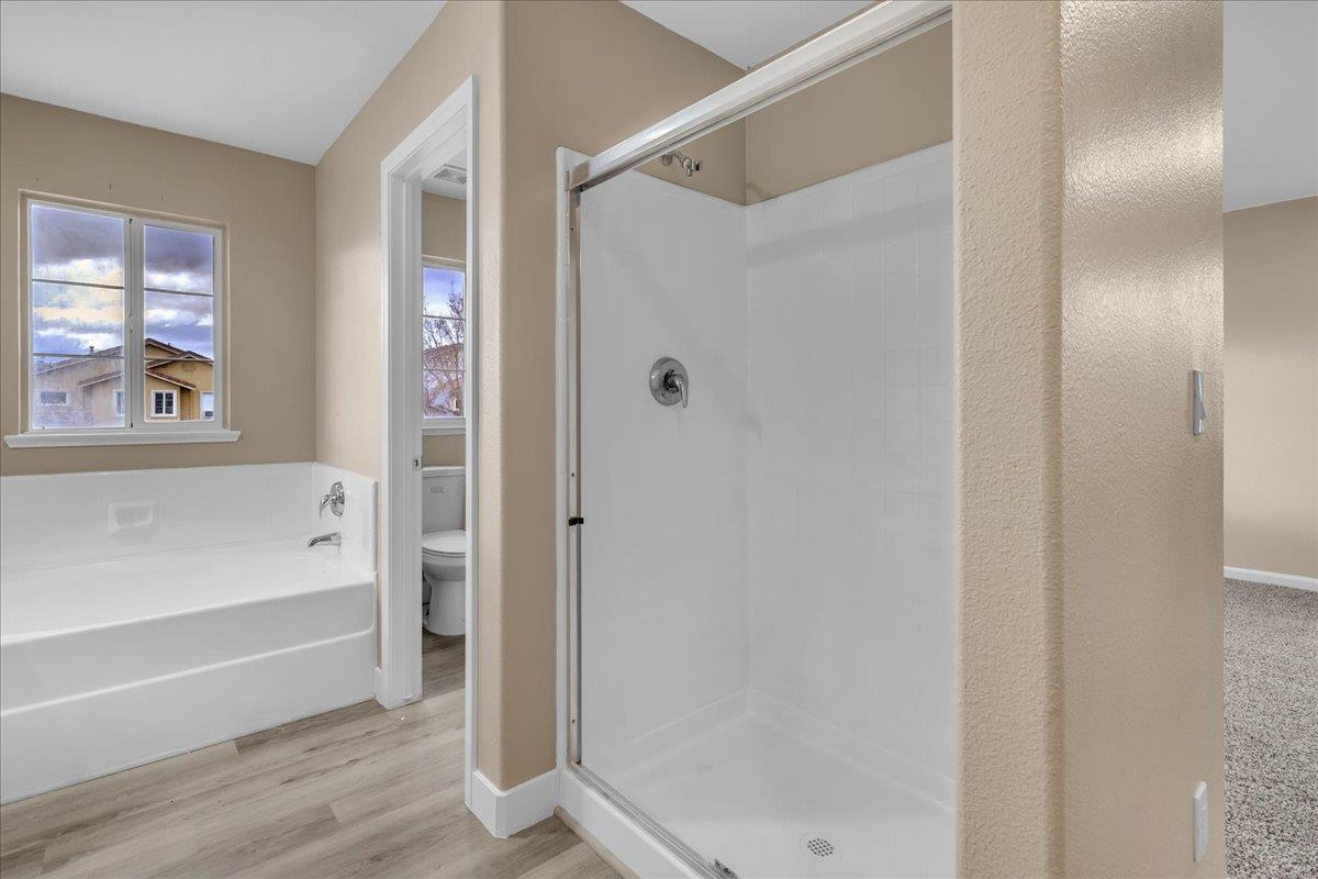 1218 Carmelo Soledad, CA 93960 - Photo 17 of 43 a bathroom with a bathtub and a shower