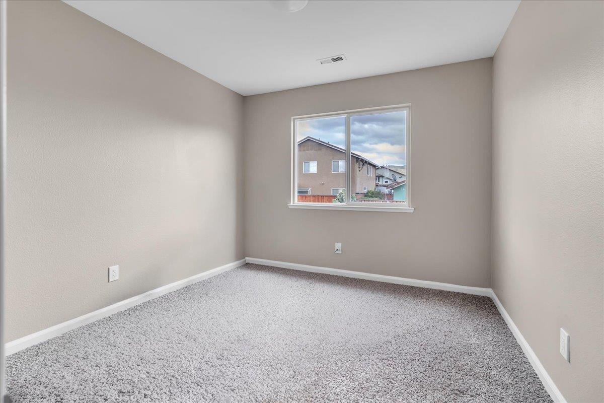 1218 Carmelo Soledad, CA 93960 - Photo 22 of 43 an empty room with windows and closet