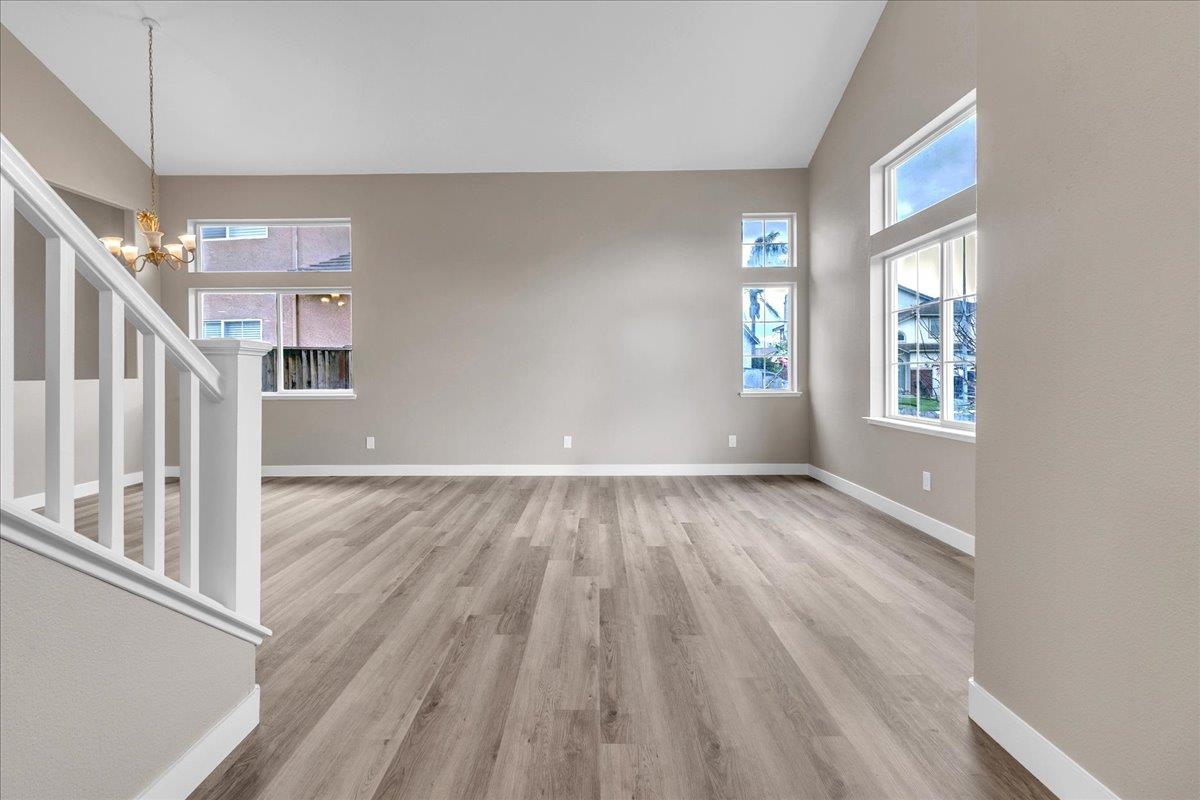 1218 Carmelo Soledad, CA 93960 - Photo 36 of 43 a view of an empty room with wooden floor and a window