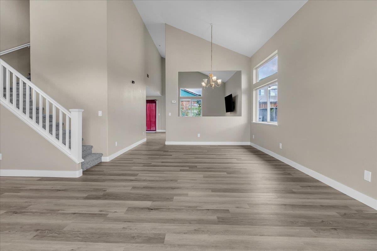 1218 Carmelo Soledad, CA 93960 - Photo 38 of 43 a view of an empty room with wooden floor and windows