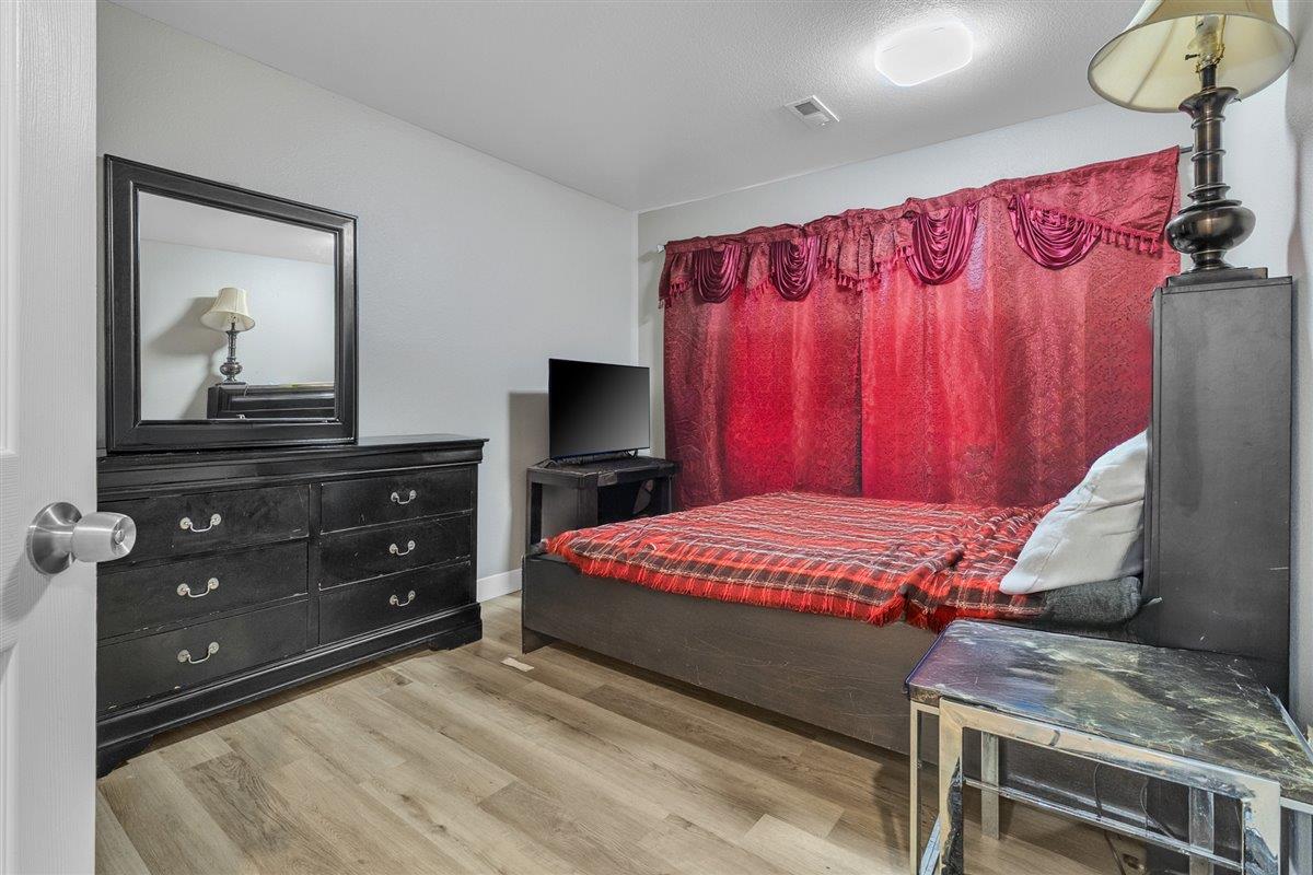 1218 Carmelo Soledad, CA 93960 - Photo 6 of 43 a bedroom with a bed and a dresser