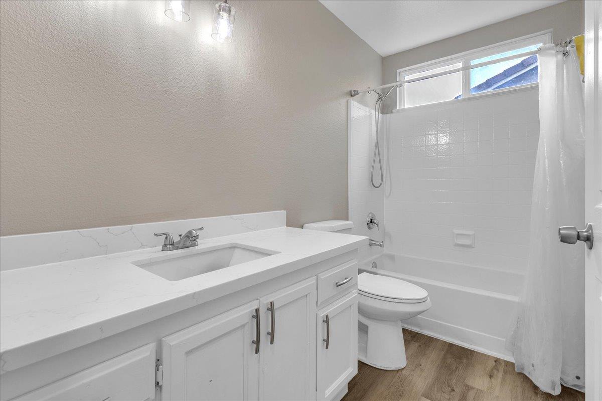 1218 Carmelo Soledad, CA 93960 - Photo 7 of 43 a bathroom with a sink a toilet and shower