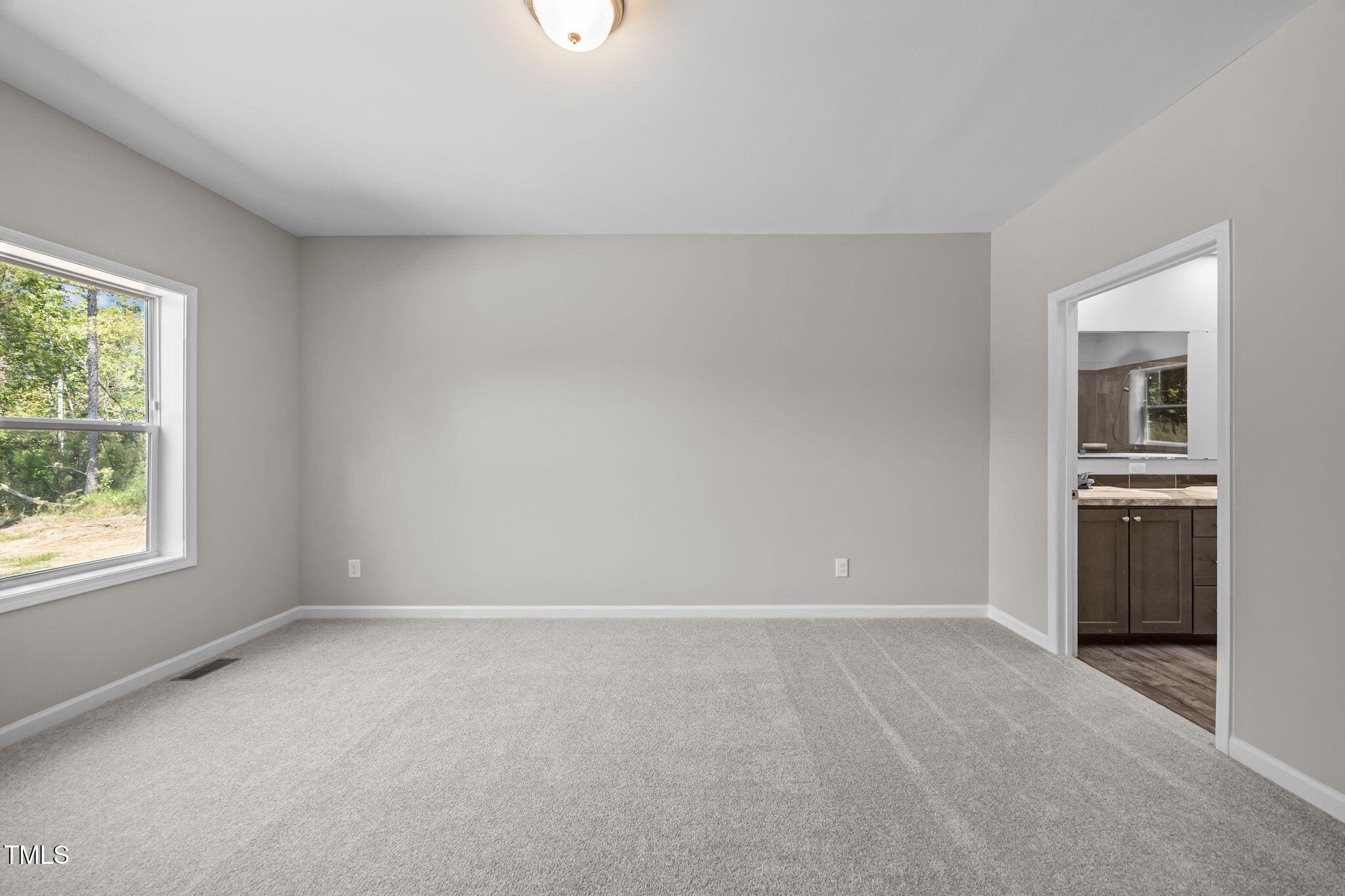 6033 David Moore Road Burlington, NC 27217 - Photo 15 of 30 Spacious primary bedroom.