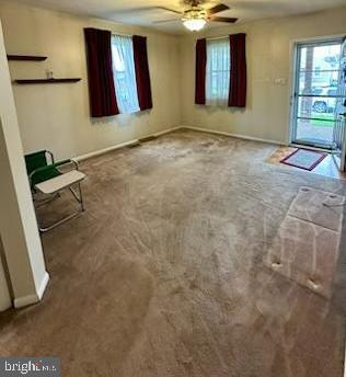 224 Pinewood Road Baltimore, MD 21222 - Photo 3 of 10 a view of an empty room with windows