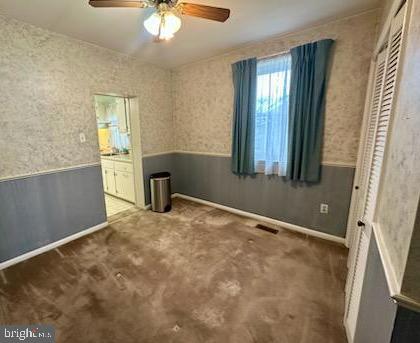 224 Pinewood Road Baltimore, MD 21222 - Photo 4 of 10 a view of an empty room with a window