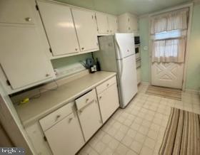 224 Pinewood Road Baltimore, MD 21222 - Photo 6 of 10 a utility room with cabinets washer and dryer